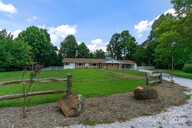 ranch-style house with a front lawn