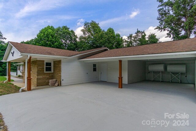 exterior space with a carport