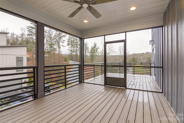 unfurnished sunroom with plenty of natural light and wooden ceiling