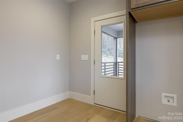 doorway with light wood-type flooring