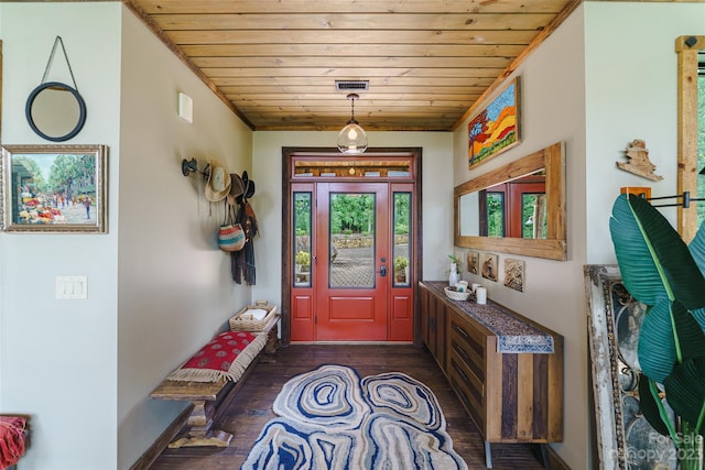 entrance foyer featuring dark hardwood / wood-style flooring and wood ceiling