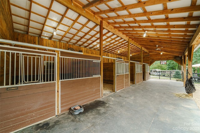 view of horse barn with an outdoor structure