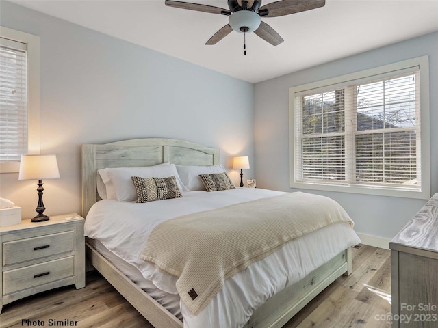 bedroom featuring ceiling fan and light hardwood / wood-style floors