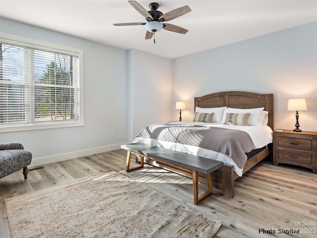 bedroom featuring light hardwood / wood-style flooring and ceiling fan