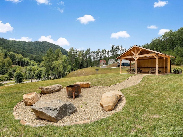 view of yard with a gazebo and an outdoor fire pit