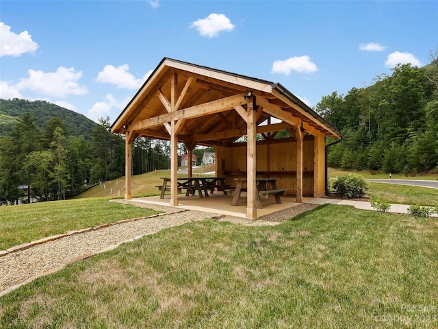 surrounding community featuring a gazebo and a yard