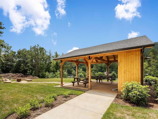 surrounding community featuring a gazebo, a lawn, and a patio