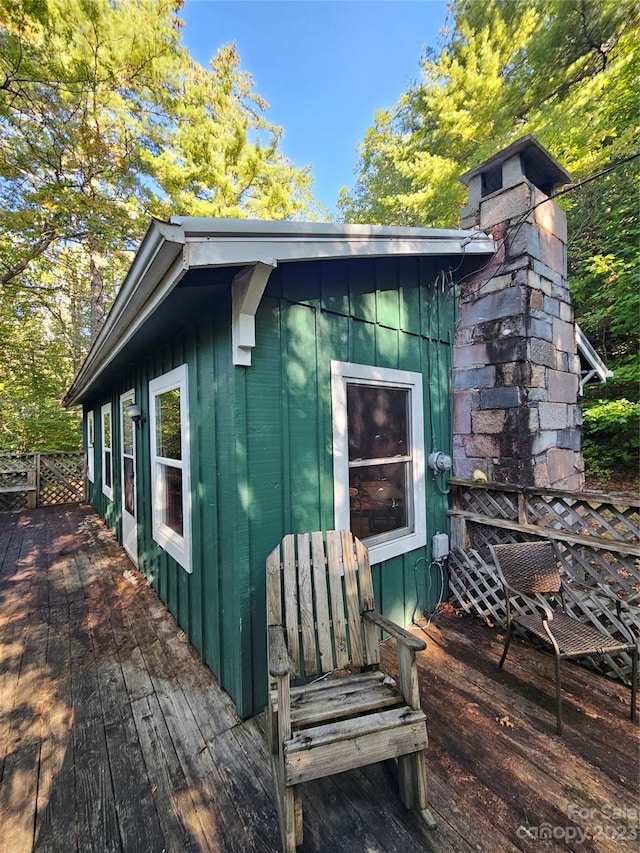 view of home's exterior with a wooden deck