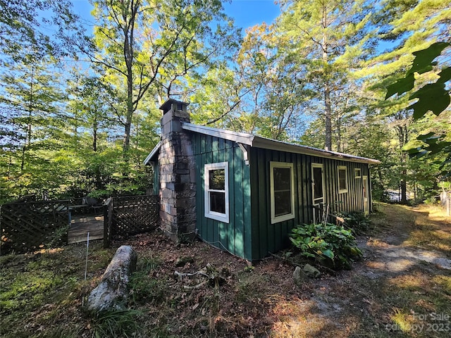 view of home's exterior with an outdoor structure