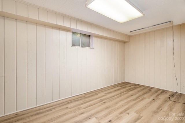 basement featuring hardwood / wood-style floors