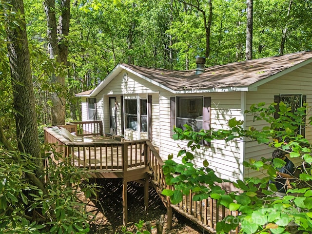 492 Laurelwood Ln Unit 33, Boone, NC 28607 - back of property featuring a wooden deck and a shingled roof