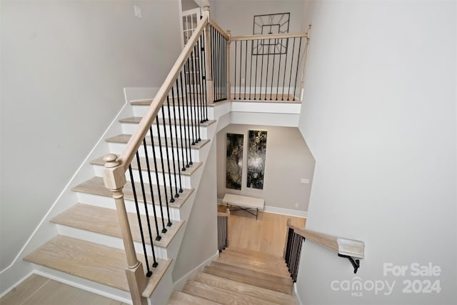 stairway featuring hardwood / wood-style floors