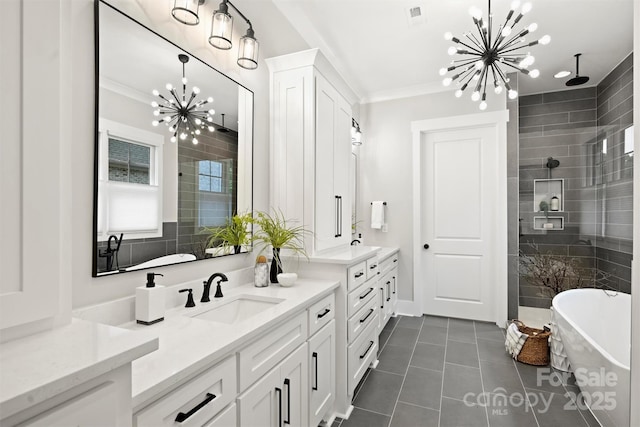 full bathroom with crown molding, an inviting chandelier, tile patterned floors, vanity, and tiled shower