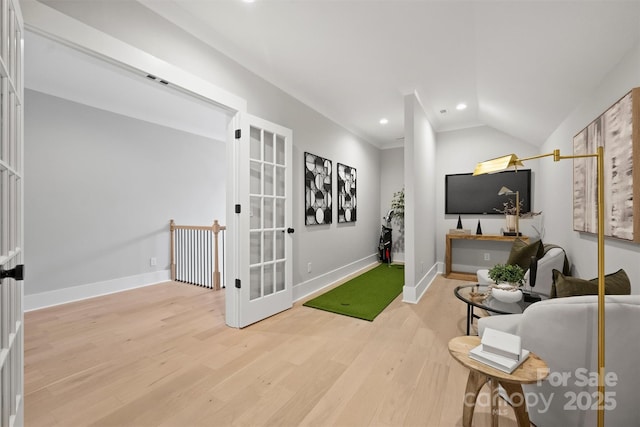 living area with lofted ceiling, recessed lighting, light wood-style flooring, and baseboards