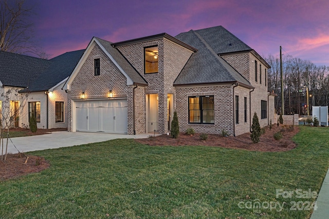 view of front of home with a lawn