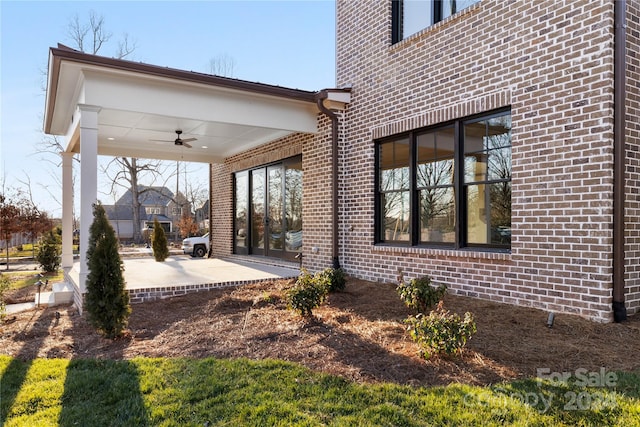 exterior space featuring a patio area and ceiling fan