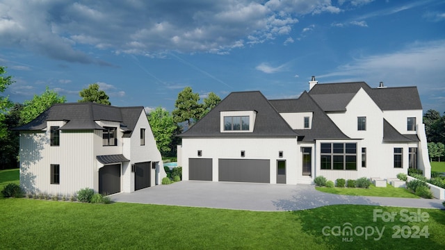 view of front facade with a front yard and a garage