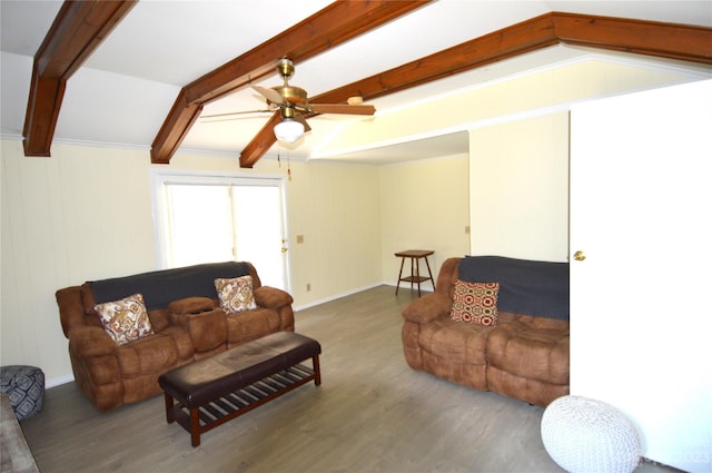 living room featuring ceiling fan, dark hardwood / wood-style floors, and beamed ceiling