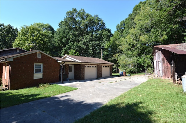 view of front facade with a front lawn and a garage