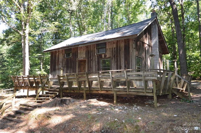 view of front of property featuring a wooden deck