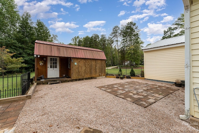 exterior space with a patio area and an outdoor structure