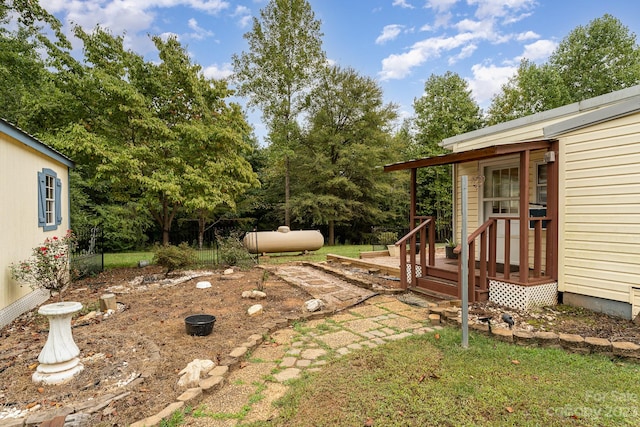 view of yard featuring a wooden deck