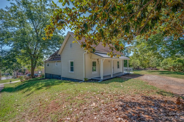 exterior space with a porch and a yard