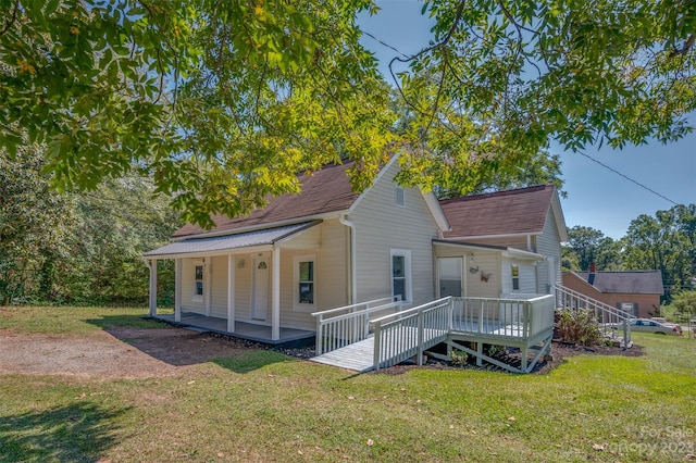 view of front of home featuring a front yard and covered porch