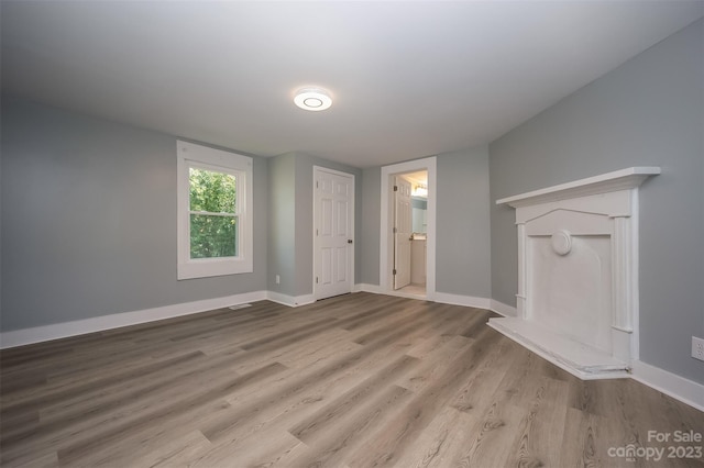 unfurnished living room with light hardwood / wood-style floors