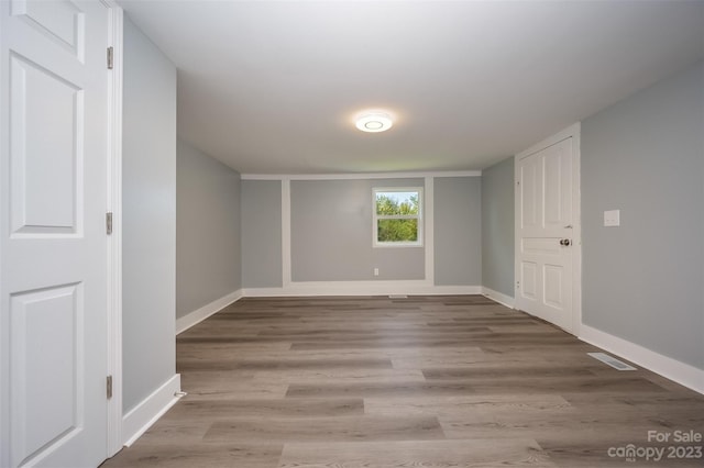 spare room with light hardwood / wood-style floors