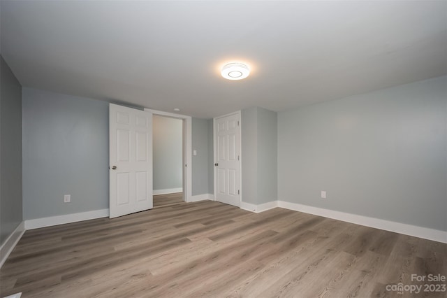 unfurnished room featuring light wood-type flooring