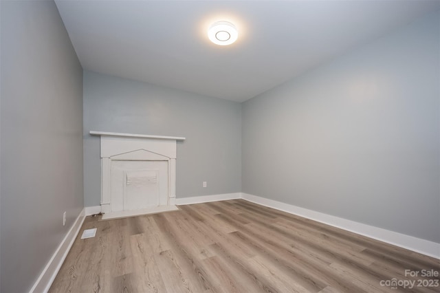 unfurnished living room featuring light hardwood / wood-style flooring