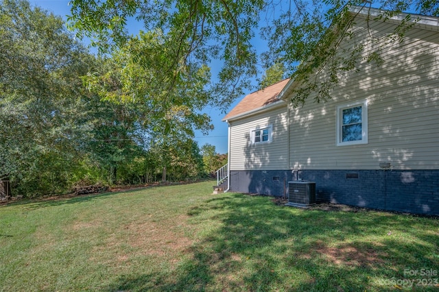 view of yard with central AC