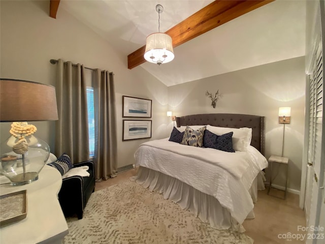 carpeted bedroom featuring lofted ceiling with beams and an inviting chandelier