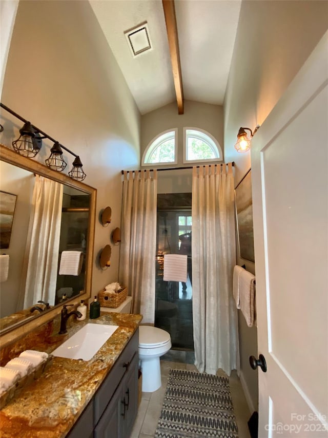 bathroom featuring vaulted ceiling with beams, large vanity, toilet, and tile floors