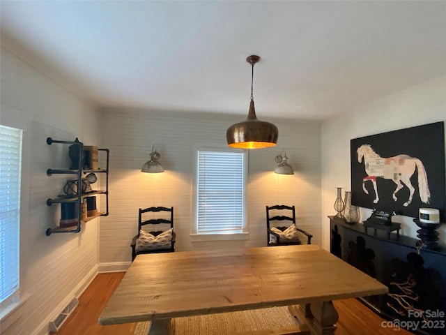 dining area with dark hardwood / wood-style flooring