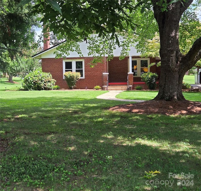 exterior space featuring a front lawn