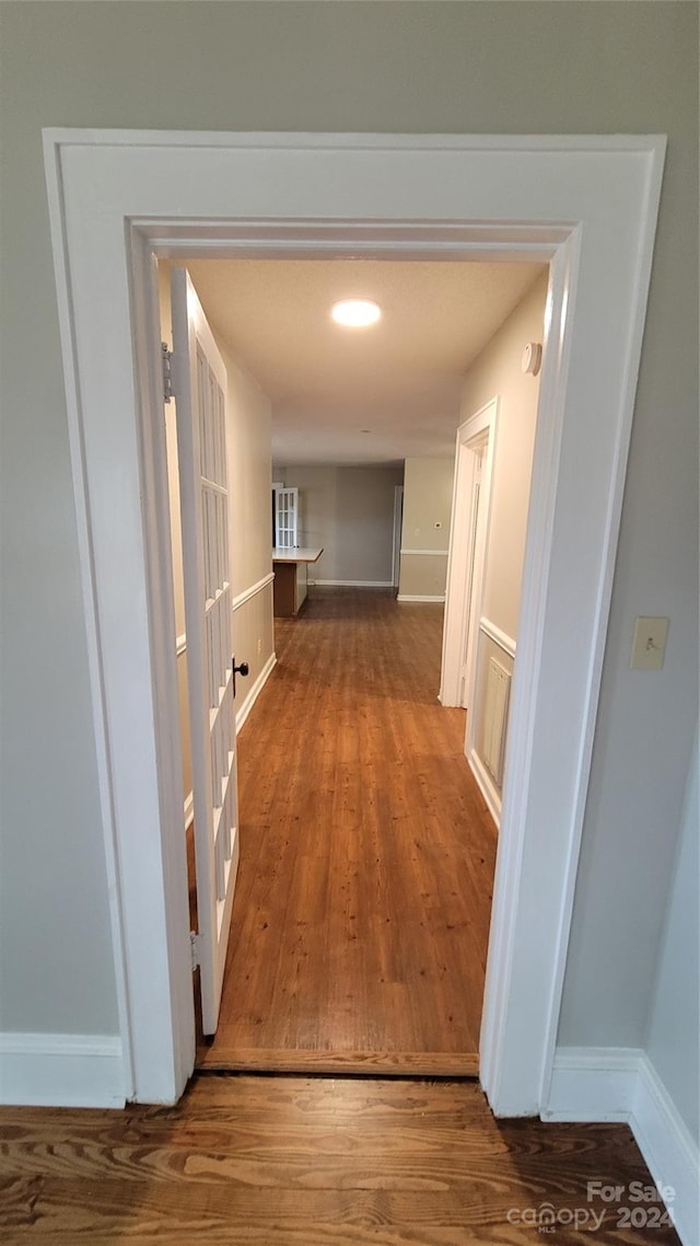 hallway featuring hardwood / wood-style floors