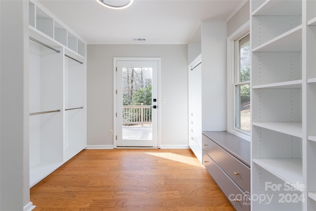 spacious closet with light hardwood / wood-style floors