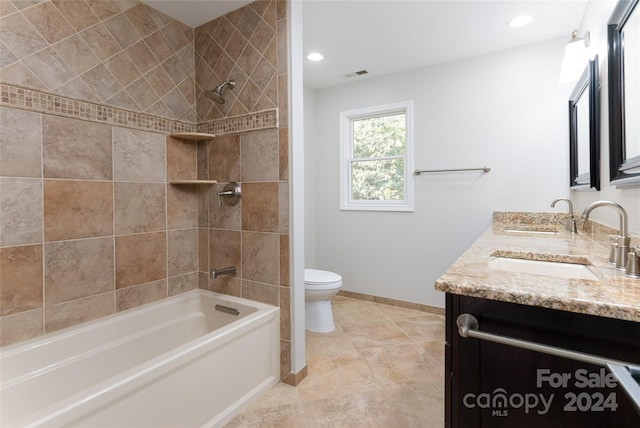 full bathroom with dual vanity, tile flooring, toilet, and tiled shower / bath combo