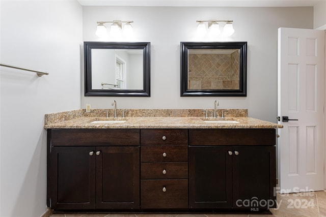 bathroom with tile floors and double sink vanity