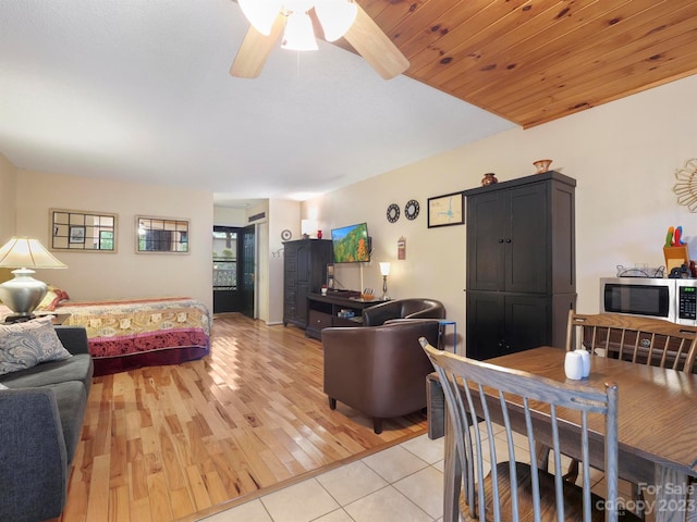 living room with ceiling fan, wooden ceiling, and light hardwood / wood-style flooring