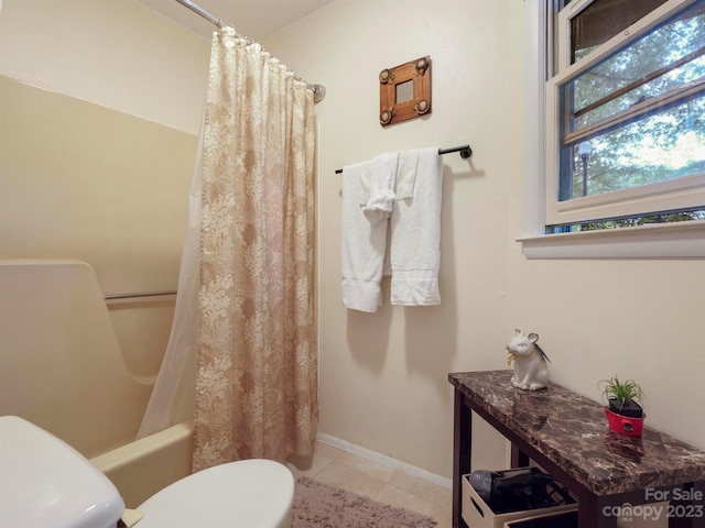 bathroom with toilet, shower / bath combo with shower curtain, and tile flooring