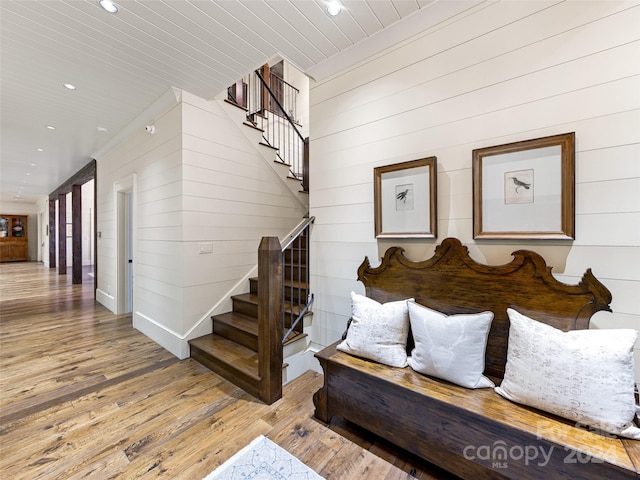 616 Old Growth Forest Rd, Burnsville, NC 28714 - living area with stairway, recessed lighting, wooden walls, and hardwood / wood-style floors