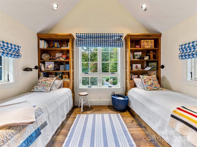 616 Old Growth Forest Rd, Burnsville, NC 28714 - bedroom with recessed lighting, multiple windows, dark wood-style flooring, and lofted ceiling
