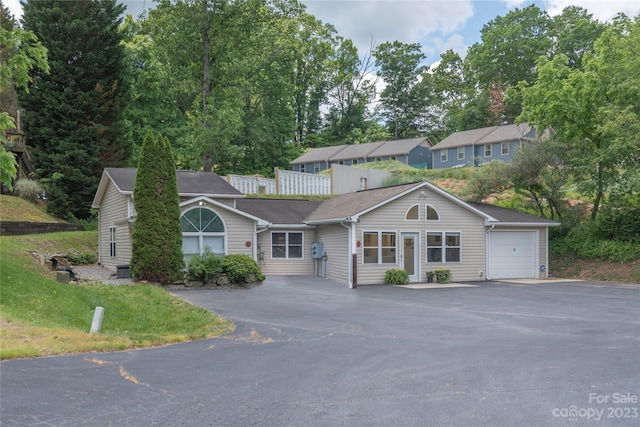 ranch-style house featuring a garage