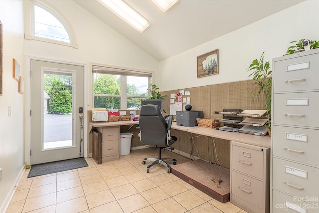 home office with light tile floors and high vaulted ceiling