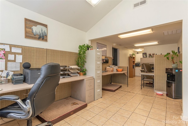 tiled office space with high vaulted ceiling and built in desk