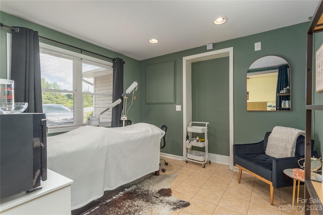 bedroom featuring light tile floors