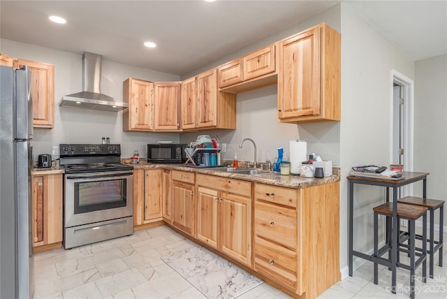 kitchen with sink, appliances with stainless steel finishes, wall chimney exhaust hood, and light tile flooring